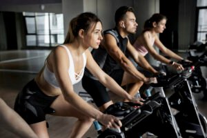 people doing indoor cycling